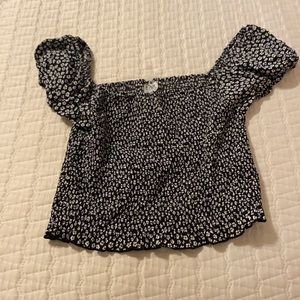 A black and white flower print top. Size 14.